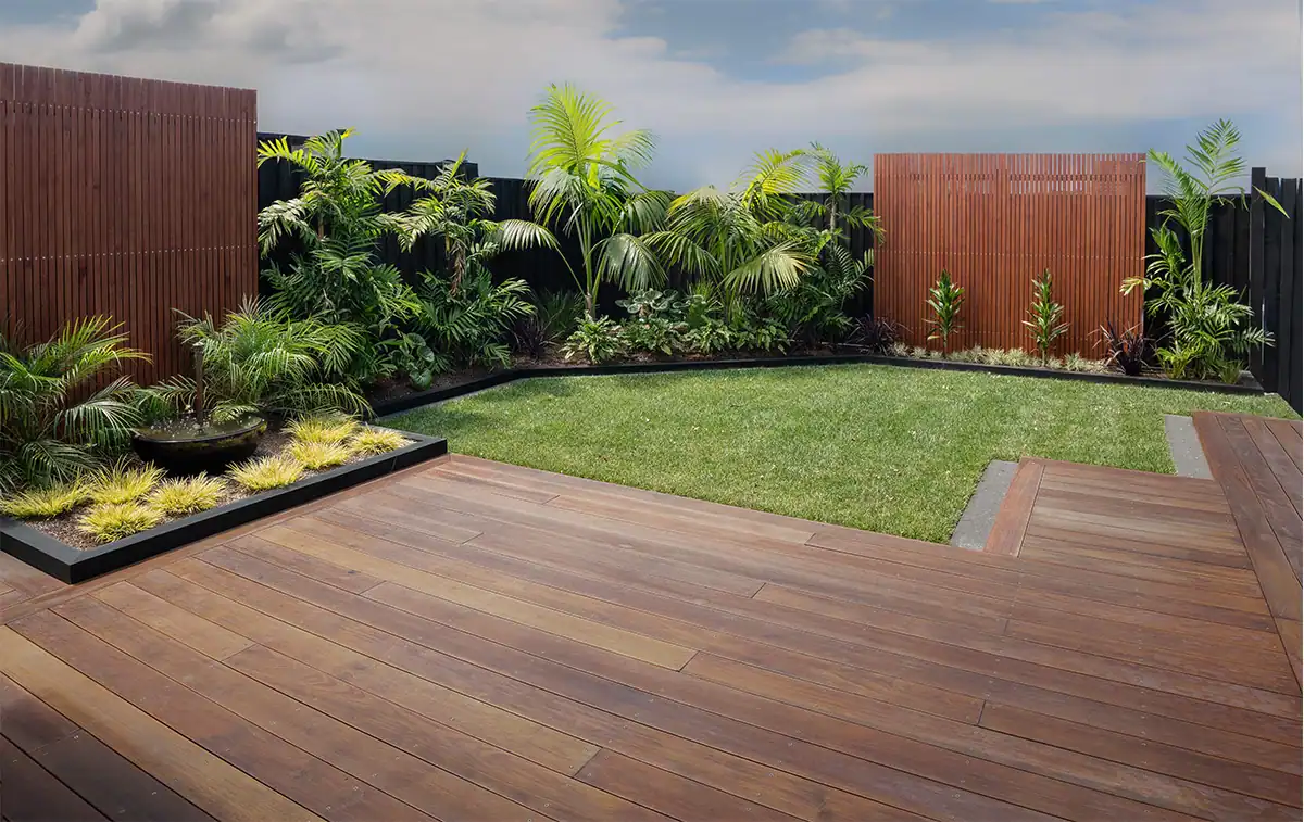 Display garden showcasing outdoor living with lawn, deck and lush tropical plants